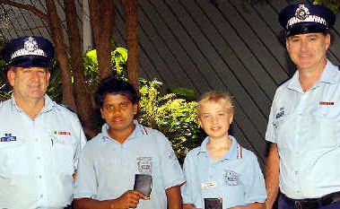 Maryborough State High School’s positive ticket recipients, Roderick McKinley and Kent Mischke, receive their awards from Sergeant Paul Behne and Senior Sergeant Tony Cole. Maryborough State High School’s positive ticket recipients, Roderick McKinley and Kent Mischke, receive their awards from Sergeant Paul Behne and Senior Sergeant Tony Cole.